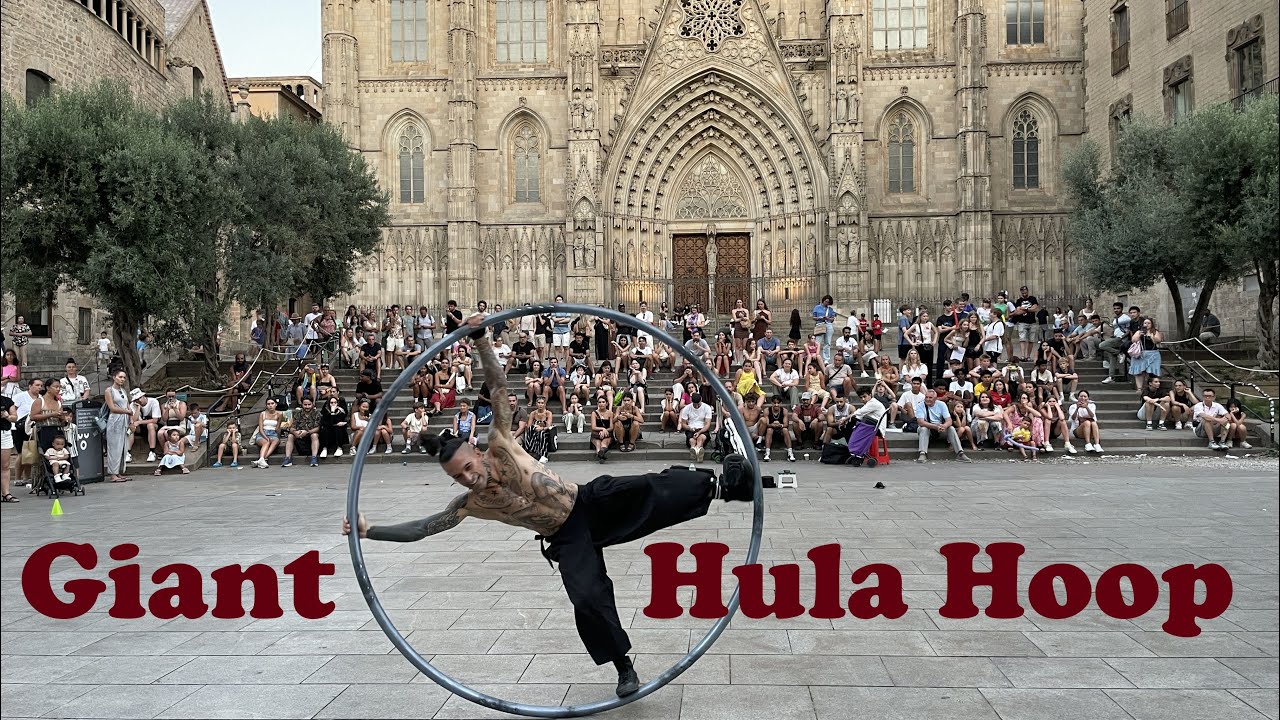 Giant Hula Hoop tricks at the Barcelona Cathedral Square, Spain.