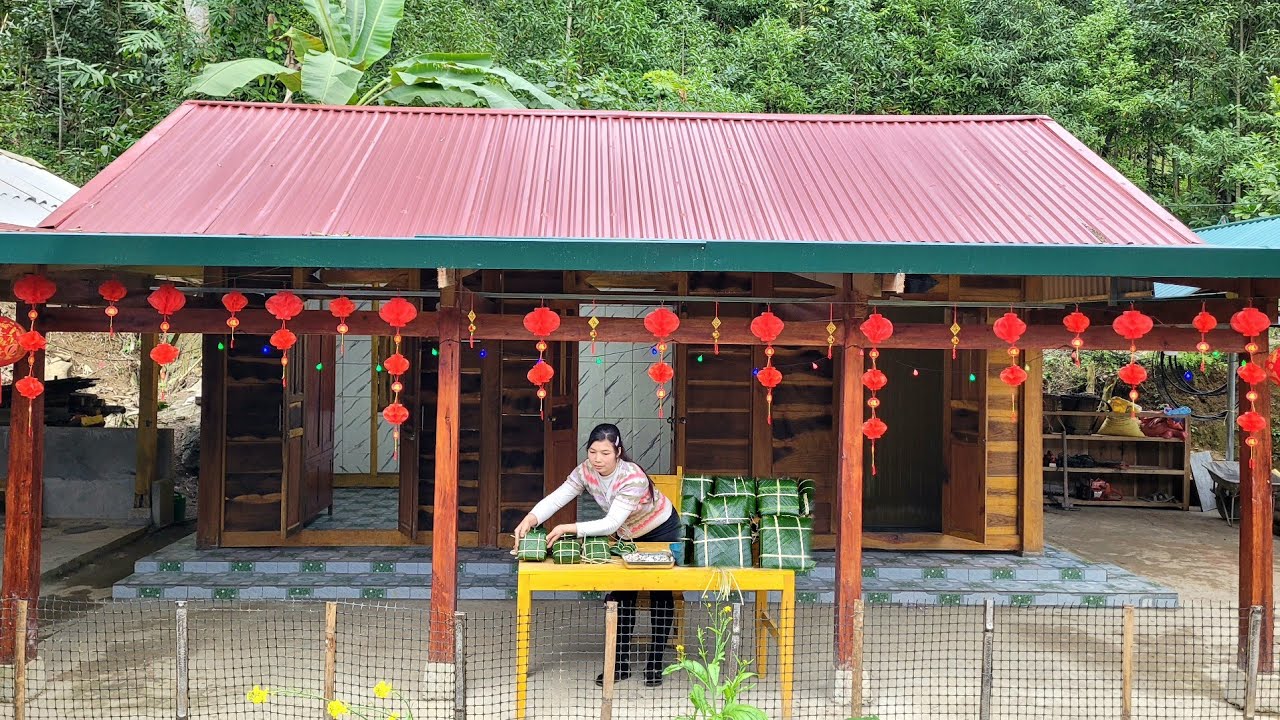 Decorating the house and making banh chung (traditional Vietnamese rice cakes) to celebrate Tet.