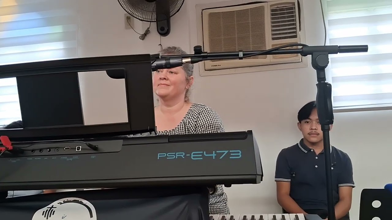 Ptr. Doug Eads  and team  sing in BMC,Jesus The Rock Locale  in Villasis,Pang.,Philippines 