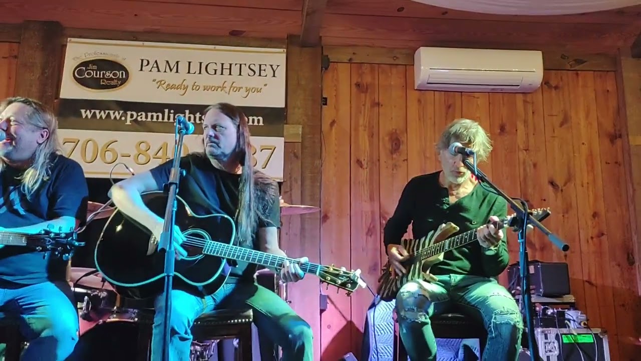 George Lynch, Reb Beach, Eric Brittingham, and Stet Howland 