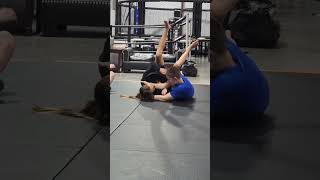 Working different sweeps from bottom to submissions in Jiu-jitsu class.