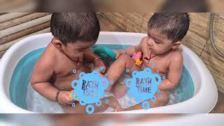 Cute twins enjoying bath time