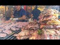 Grilled Meat Roasted Texas Style. Juicy Pork Loin, Ribs and more. Street Food Fair in Italy