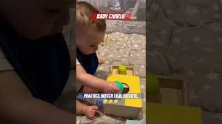 Baby Charlie working on his coordination with Ball Drop Box