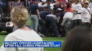 Military officer hospitalized after fall during pregame stunt