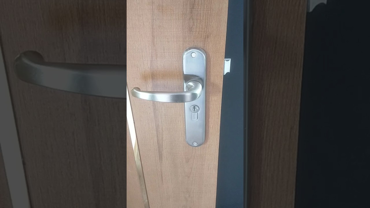 Bedroom door lock fitting with handle