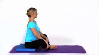 Sit upright on the front half of a foam block or firm cushion.
lengthen your spine and back neck, relaxing shoulders. bring soles
you...