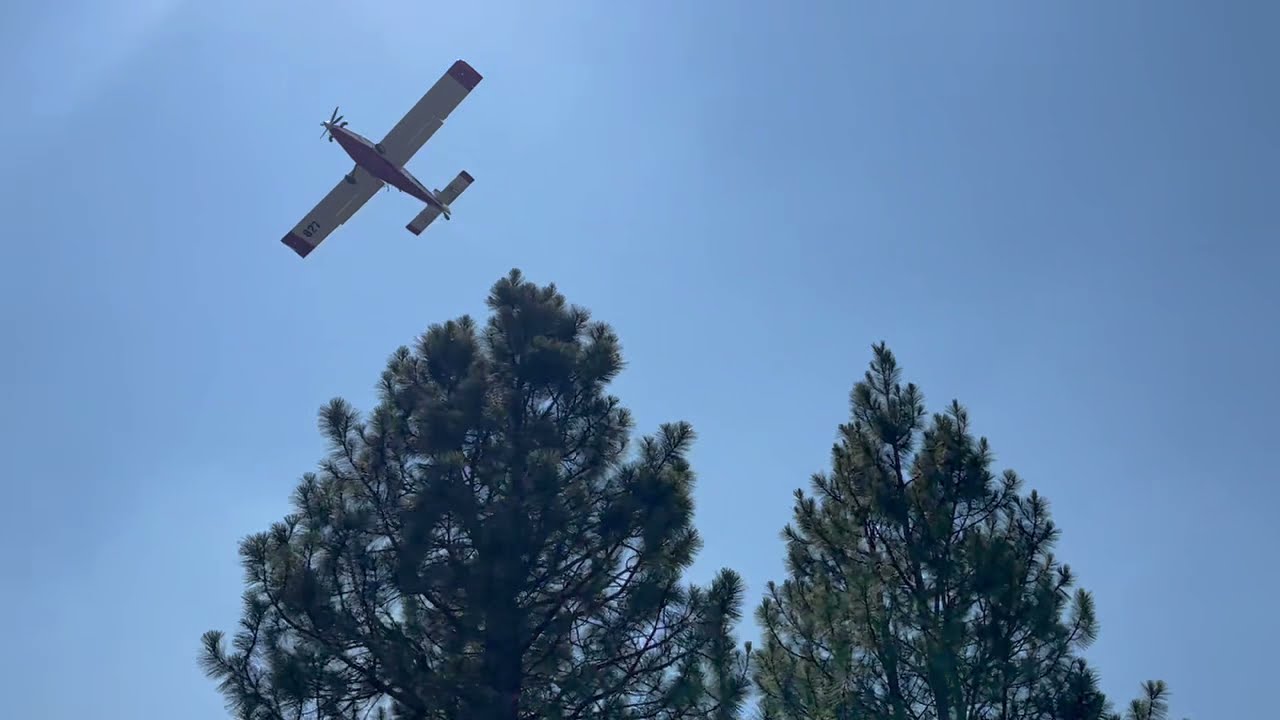 Single Engine Air Tanker (SEAT) Drops Retardant to Protect Homes Threatened by the Bootleg Fire