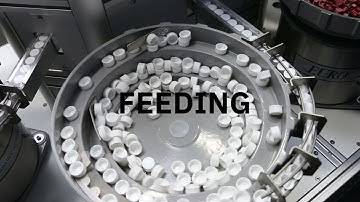 Feeding, filling, capping and labelling systems
