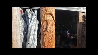 Live out door power carving, Whimsical face.