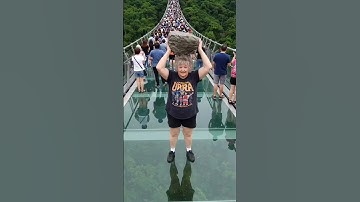 This dumb old lady was angry so she broke the glass bridge