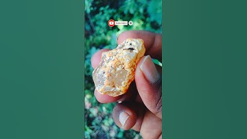 This agate is white to light beige in color with prominent orange-brown inclusions