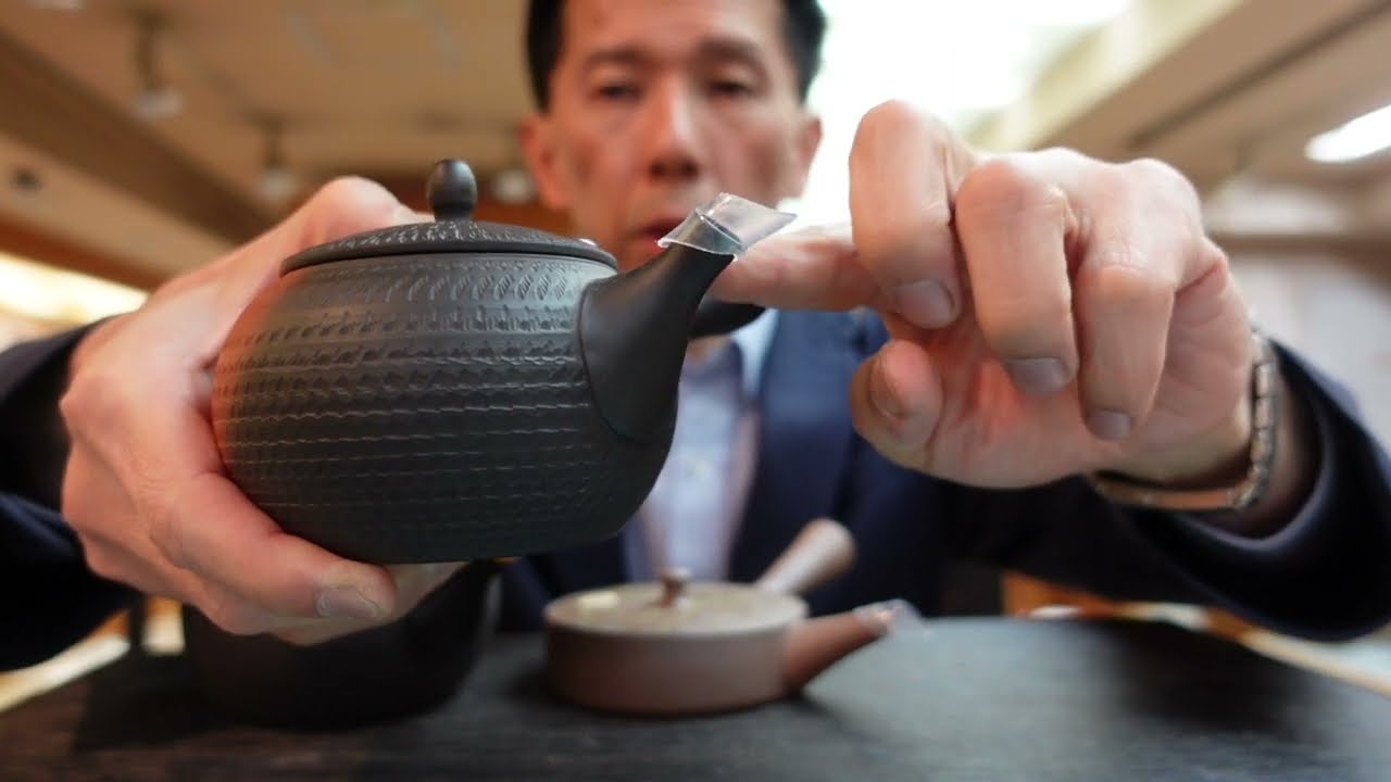 Remove the plastic cover from the spout of your teapot or clay
