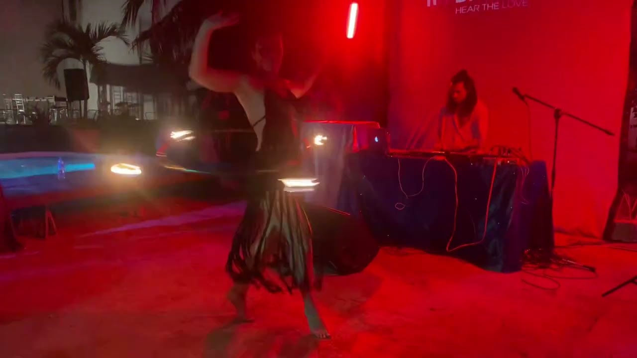 Flambetta  fire hula hoop performance in Tulum 2023