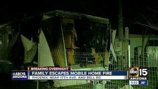 Phoenix family escapes mobile home fire