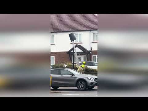 Hilarious video shows firefighters using bizarre technique to dislodge bin placed over ULEZ camera