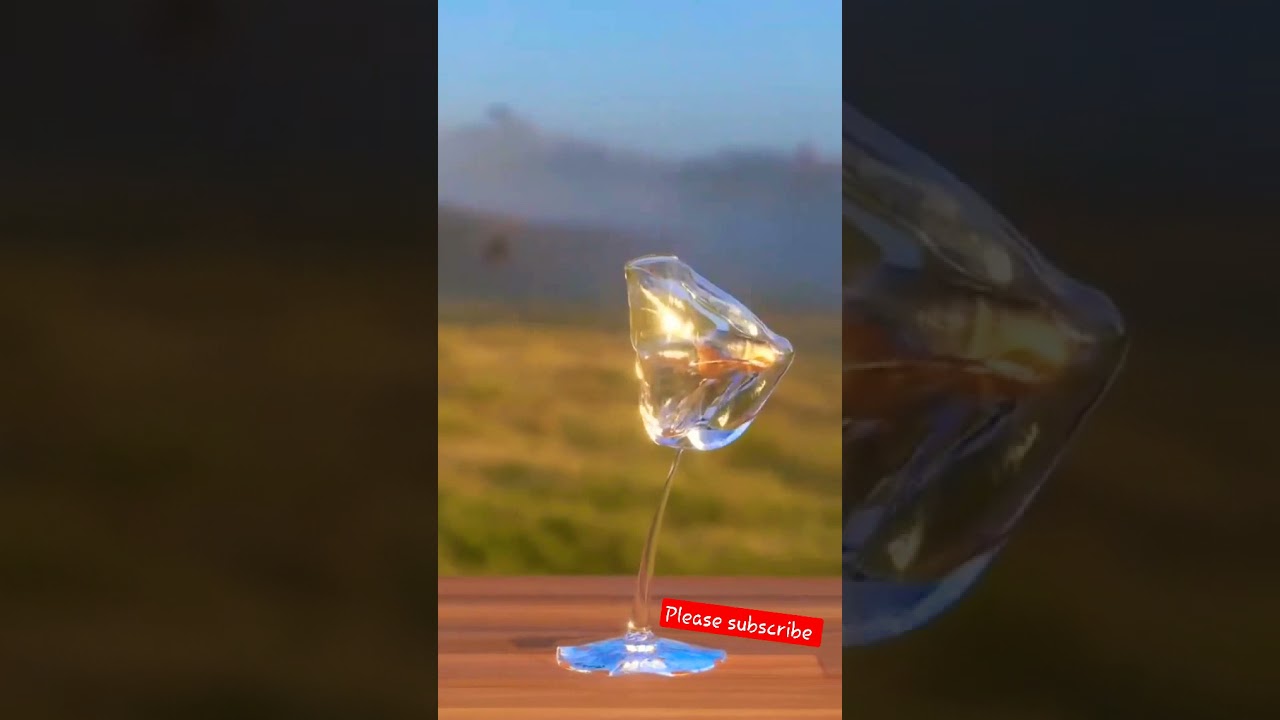 Bullet shot through wine glass slow mo. 
