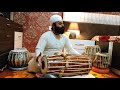 Founder director of tabla jori taal academy  gian singh  playing mridang pakhawaj in soolfaak taal