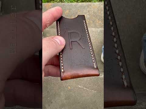 Richter Knives Wood Grain Leather Slip. Dark brown dye. Cream Tiger thread. Hand stitched.