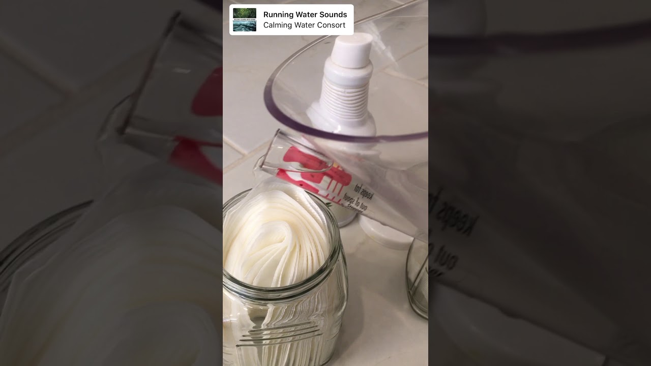 Pouring the Thieves Mixture into the jar for Thieves Wipes