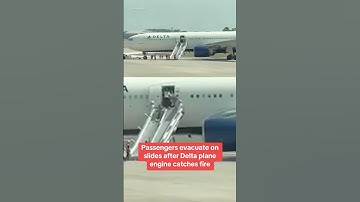Passengers evacuate on slides after Delta plane catches fire #shorts