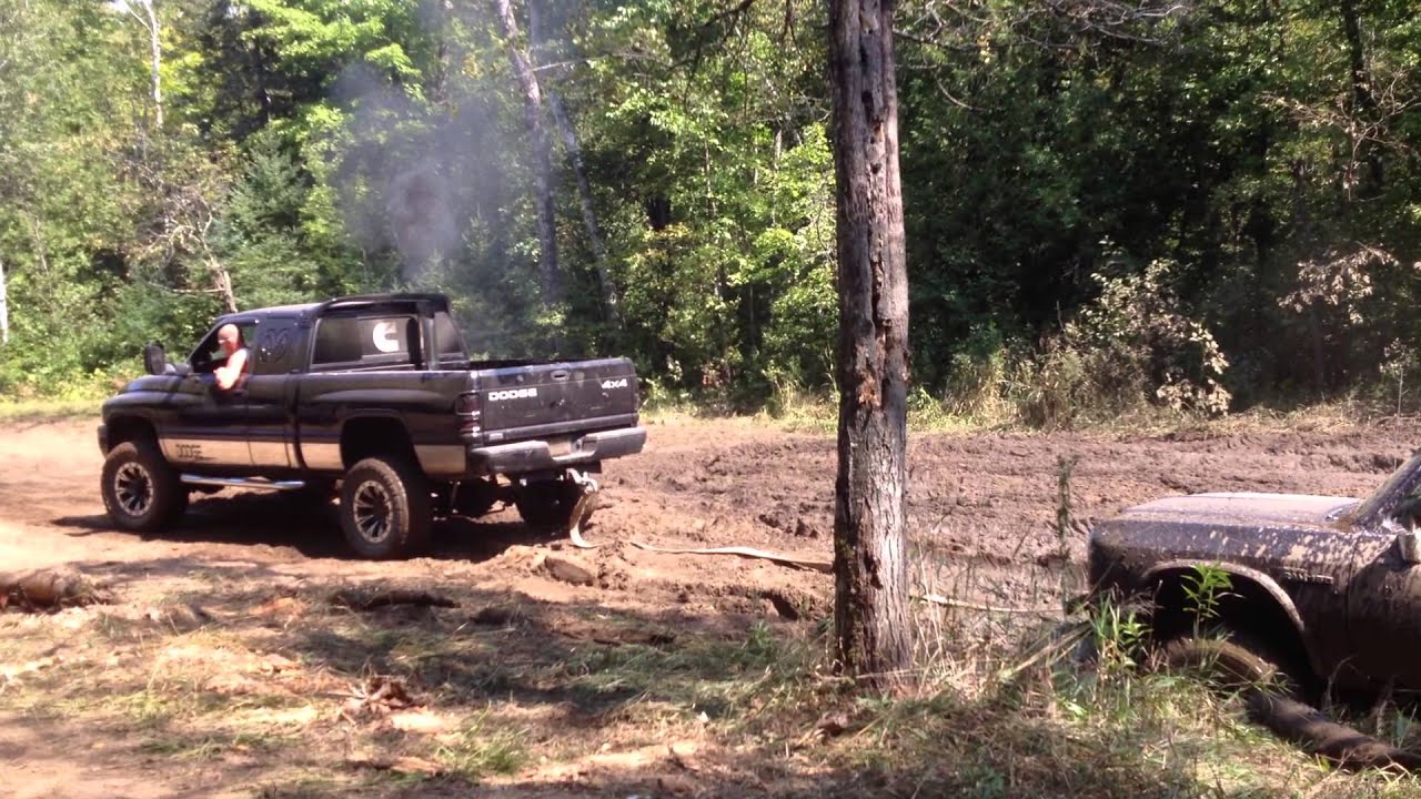 Cummins Pulling Dodge Out of a Mud Hole - YouTube