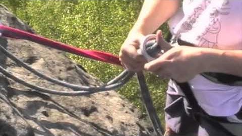 Setting up for rappelling at the top of a tower
