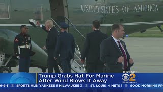 President Trump Grabs Marine's Hat After Wind Blows It away