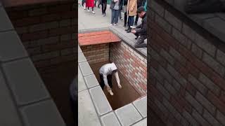 Watch A Mindblowing 3d Street Art Prank  Man Falls Through Deep Hole But Its Not What It Seems