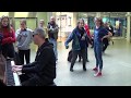 Actor On The Way To Theatre Approaches A Street Piano