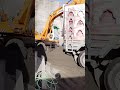 The dumper is stuck. Heavy Excevator machine emptying the dumper