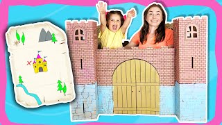 Playing treasure hunt in the colorful cardboard castle. Magical adventure. Video for kids