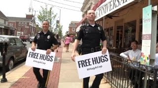 What Happens When Two Police Officers Offer Free Hugs Resimi