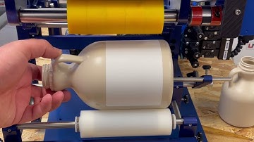LabelMill Semi-Automatic Label Applicator with Round Module to Apply Labels to Various Jug Sizes.