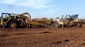 CAT D10T Dozers pushing 651B scrapers  D8T Dozer Ripping Dirt. Amazing Earthmovers