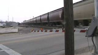 Idiot pulls out in front of an empty BNSF grain train.wmv