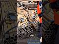 Industrial Worker Uses High Power Pneumatic Tool To Band Steel Pipes Safely