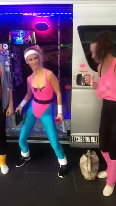 Girl in pink leotard and Blue Lycra Tights.