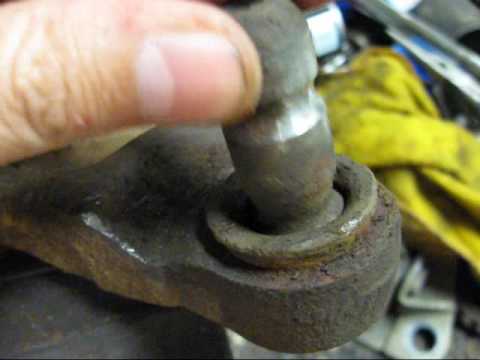 What are some symptoms of worn ball joints?