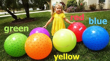 Diana plays with giant inflatable balls