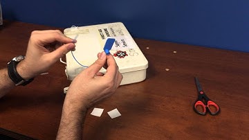How to install a tamper seal on a first aid kit