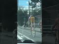 Man has a unique way of riding seatless bicycle