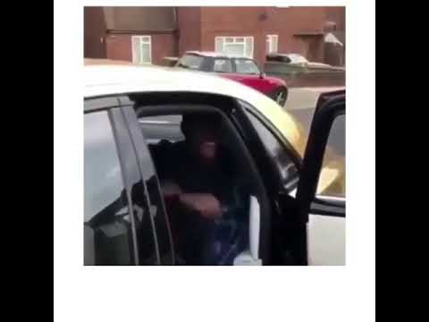 guy-laughing-while-he-gets-in-gold-car