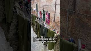 Ukrainian artist brings battle-worn uniforms to Venice Biennale