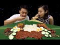 We cook Nasi Lemak with ingredients from Malaysia
