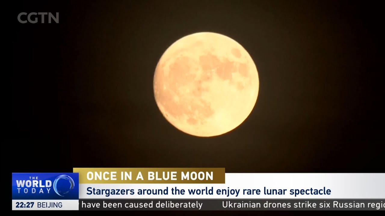 Rare blue supermoon lights up night skies - YouTube