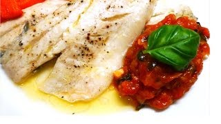 Сибас запечённый в фольге с лимоном и сливочным маслом, приправленный томатным соусом с базиликом. Сибас запечённый в фольге с лимоном и сливочным маслом, приправленный томатным соусом с базиликом.