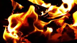Mesmerizing flames dance in the dark.