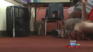 Schools with out air conditioning try to stay cool