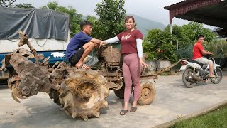 Girl repairs and restores a tractor buried after the storm.